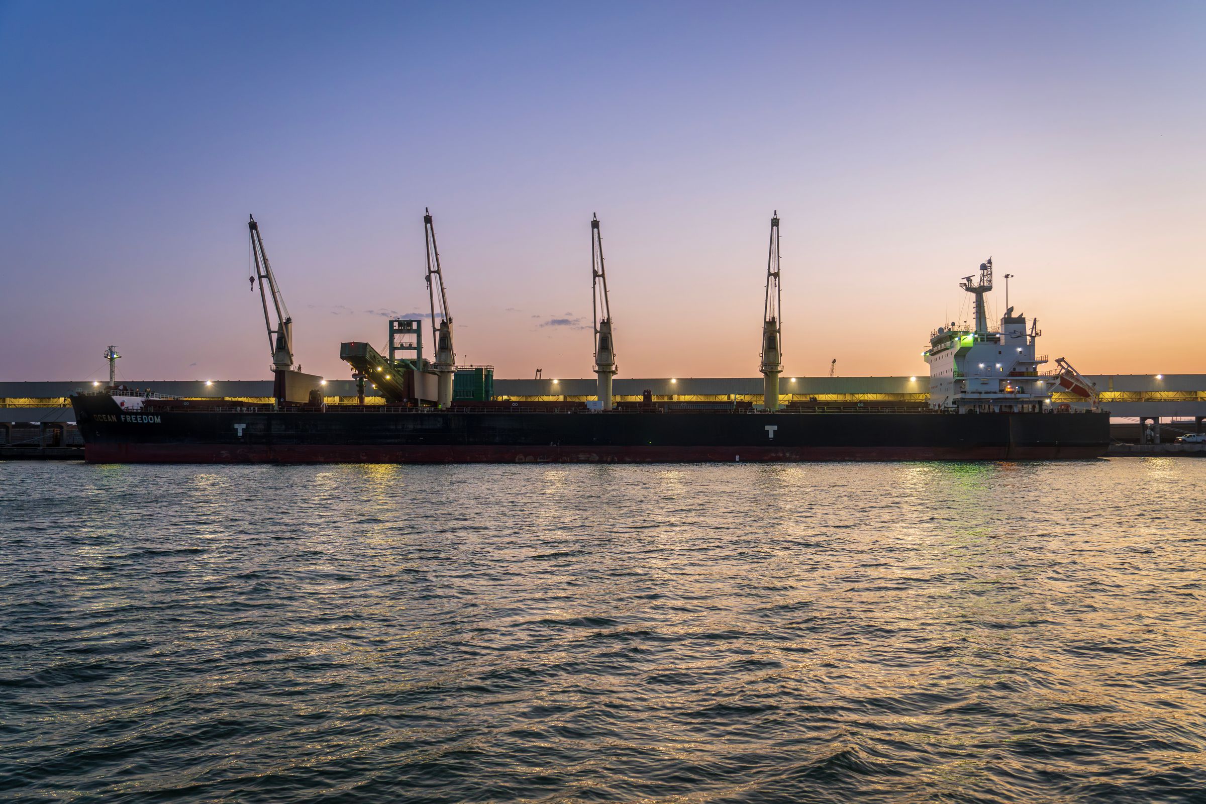 Ocean cargo vessel docked at an international port